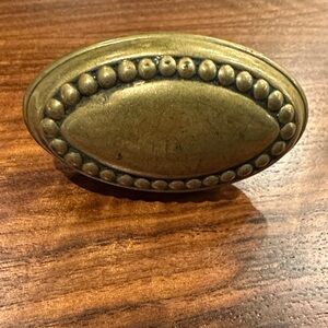 ANTIQUE BRASS OVAL DOOR KNOB WITH BEADING